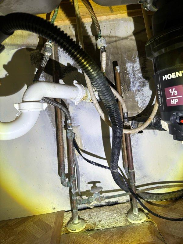 Responded to leaking kitchen faucet in 1970s-era home. Upon inspection, identified worn cartridge and deteriorated O-rings as source of leak. Replaced faulty cartridge assembly, installed new seals, and tested operation to confirm proper function and elimination of water drip. System restored to normal operation with no further leakage detected.