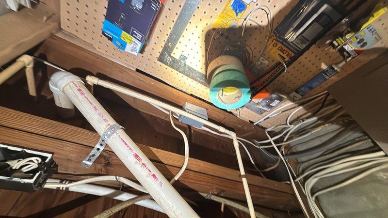 Responded to emergency plumbing call for broken faucet in basement causing active water leak. Upon arrival, located failed faucet fixture in basement utility area near HVAC equipment and successfully stopped water flow to prevent further damage. Assessed plumbing infrastructure including exposed copper supply lines and PVC drainage system, verified all connections were secure, and confirmed leak was isolated to the faucet assembly requiring replacement or repair.