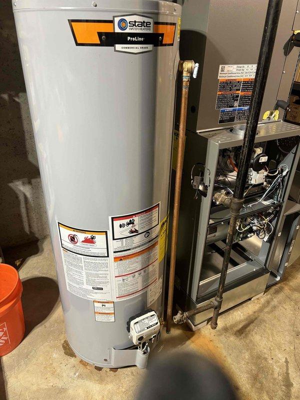 Installed a 40-gallon State ProLine Commercial Series gas water heater in the basement mechanical room in coordination with HVAC work on the property. The installation included proper copper piping connections and the addition of a thermal expansion tank to protect the system from pressure buildup. All components were installed per manufacturer specifications and local plumbing codes, with the unit positioned adjacent to the existing HVAC equipment for efficient utility access.
