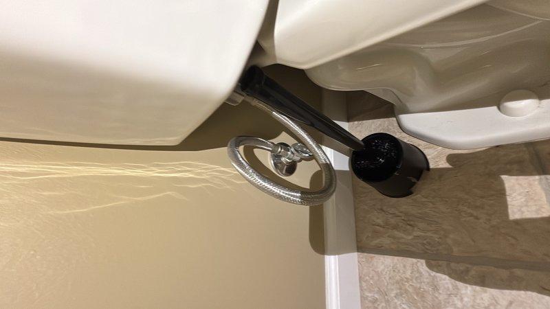 Completed comprehensive whole-home plumbing inspection as part of complimentary preventative maintenance program. Performed systematic evaluation of all accessible plumbing fixtures, supply lines, drainage systems, and water supply components throughout the residence. 

Inspected bathroom plumbing including toilet installation, water supply connections, shut-off valve operation, and flexible braided stainless steel supply line condition. Verified proper toilet mounting, seal integrity, and absence of leaks at connection points. Confirmed chrome shut-off valve functionality and appropriate water flow. Examined tile flooring surrounding fixtures for signs of water damage or moisture intrusion with no issues noted.

Evaluated attic space plumbing infrastructure including black PVC drainage piping, pipe supports, and routing. Inspected pipe joints, elbow connections, and mounting brackets for secure installation and proper slope. Verified adequate pipe support and absence of stress points 