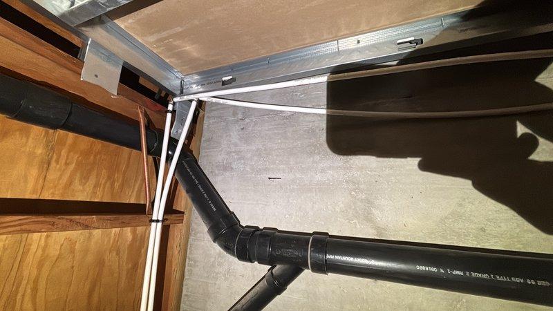 Completed comprehensive whole-home plumbing inspection as part of complimentary preventative maintenance program. Performed systematic evaluation of all accessible plumbing fixtures, supply lines, drainage systems, and water supply components throughout the residence. 

Inspected bathroom plumbing including toilet installation, water supply connections, shut-off valve operation, and flexible braided stainless steel supply line condition. Verified proper toilet mounting, seal integrity, and absence of leaks at connection points. Confirmed chrome shut-off valve functionality and appropriate water flow. Examined tile flooring surrounding fixtures for signs of water damage or moisture intrusion with no issues noted.

Evaluated attic space plumbing infrastructure including black PVC drainage piping, pipe supports, and routing. Inspected pipe joints, elbow connections, and mounting brackets for secure installation and proper slope. Verified adequate pipe support and absence of stress points 
