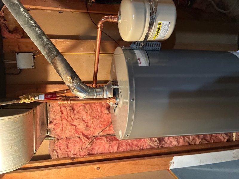 Completed comprehensive whole home plumbing maintenance inspection. Evaluated water heater installation in attic space, including copper piping connections, expansion tank mounting, and associated plumbing components. Tested exterior hose bib pressure and functionality, confirmed proper operation of shut-off valve and pressure readings within normal range.