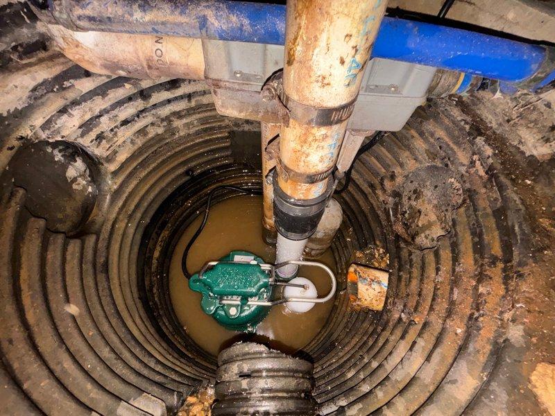 Replaced failed sump pump with new 1/3 HP unit in basement sump basin. The existing pump showed severe rust and corrosion throughout the housing and metal components, rendering it ineffective for proper water removal. Installed the new pump with proper discharge piping connections to ensure reliable operation and basement flood protection.