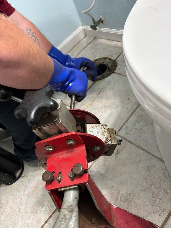 Performed hydro-jetting service on main sewer line at front of house. Upon inspection, discovered leaking elbow fitting inside basement during jetting operation. Utilized drain cleaning equipment and camera inspection system to assess line condition and identify compromised fitting requiring repair.