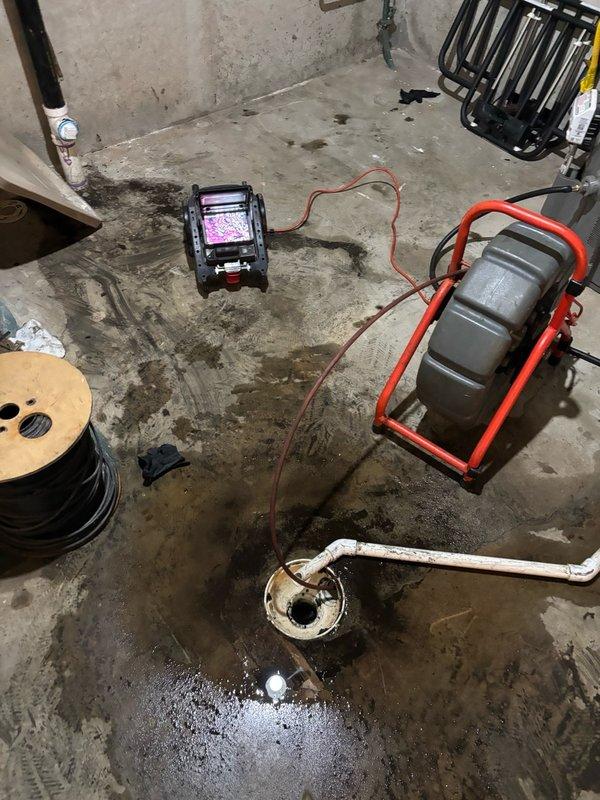 Performed hydro-jetting service on main sewer line at front of house. Upon inspection, discovered leaking elbow fitting inside basement during jetting operation. Utilized drain cleaning equipment and camera inspection system to assess line condition and identify compromised fitting requiring repair.