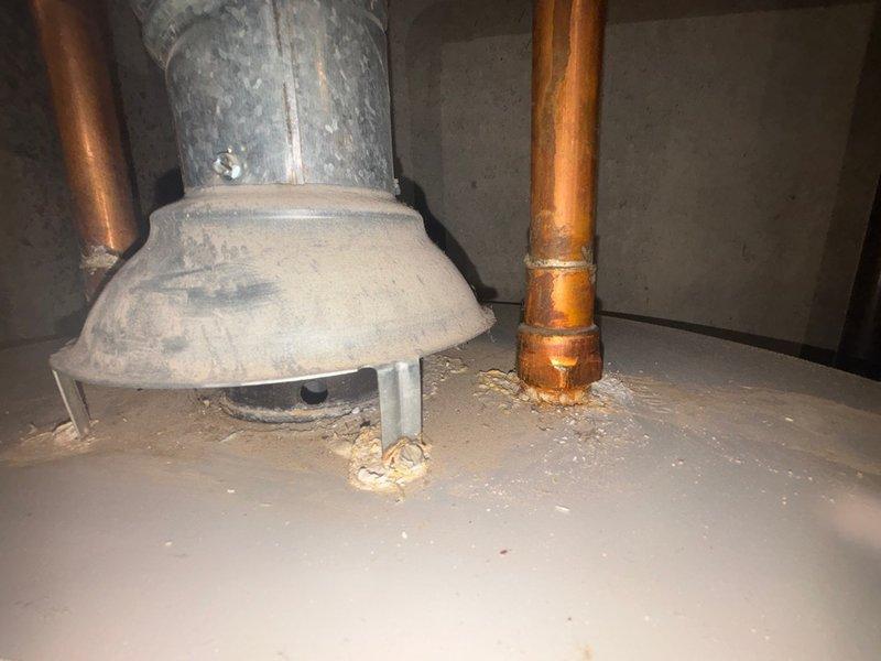 Responded to reported backup in basement storage room drain with white chunky discharge and clear liquid. Upon inspection, located the affected floor drain and associated plumbing infrastructure in the basement mechanical area. Assessed the drainage system including visible piping, connections, and water heater proximity to identify source of backup. Examined copper supply lines, galvanized drain components, and floor drain assembly showing signs of age and corrosion. Cleared blockage causing the backup and white debris discharge. Tested drain flow to confirm proper drainage restored. Recommended monitoring for recurring issues due to aging plumbing infrastructure observed during service call.