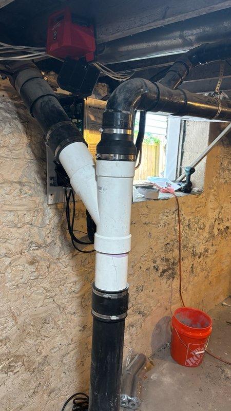 Removed and replaced a leaking 4-inch fitting on the main drain stack in the basement. Cut out the damaged section of pipe and installed new white PVC piping with proper hub fittings and rubber coupling connectors to tie back into the existing drain line. Additionally, unclogged the basement floor drain as requested. Tested the entire system after installation to confirm proper drainage and verified no leaks were present at any of the new connections.