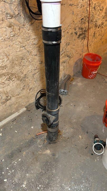 Removed and replaced a leaking 4-inch fitting on the main drain stack in the basement. Cut out the damaged section of pipe and installed new white PVC piping with proper hub fittings and rubber coupling connectors to tie back into the existing drain line. Additionally, unclogged the basement floor drain as requested. Tested the entire system after installation to confirm proper drainage and verified no leaks were present at any of the new connections.