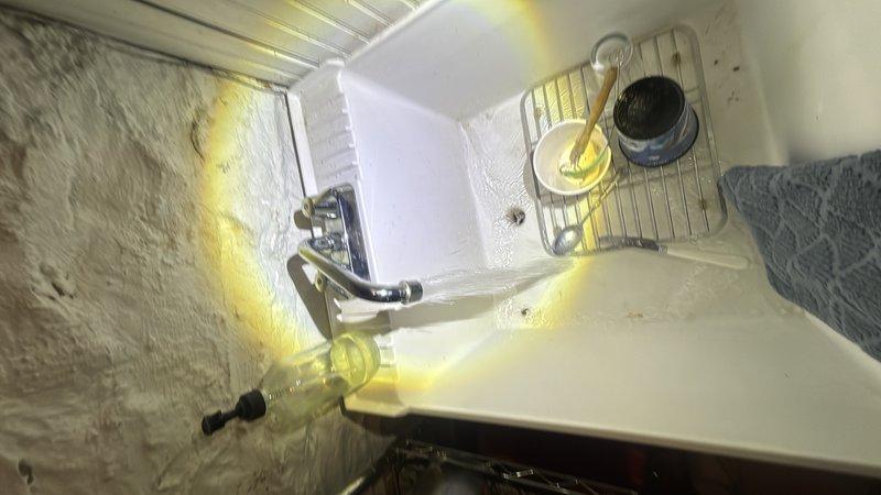Completed routine plumbing maintenance inspection of residential bathroom and utility room facilities. Documented existing plumbing connections, including toilet water supply line installation and mechanical room infrastructure, with photographic records showing all fixtures and components in operational condition.