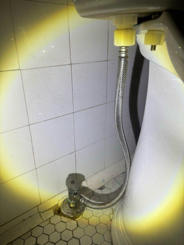 Completed routine plumbing maintenance inspection of residential bathroom and utility room facilities. Documented existing plumbing connections, including toilet water supply line installation and mechanical room infrastructure, with photographic records showing all fixtures and components in operational condition.
