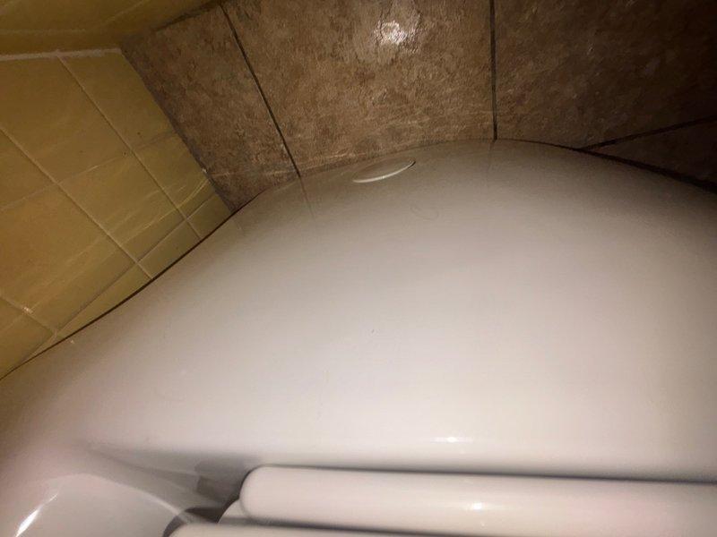 Completed installation of customer-supplied toilet in residential bathroom. Removed existing fixture, prepared flange and wax ring seal, positioned and secured new white porcelain toilet to floor with closet bolts, connected water supply line, and tested for proper operation and leaks. Verified stable mounting and proper flush function upon completion.