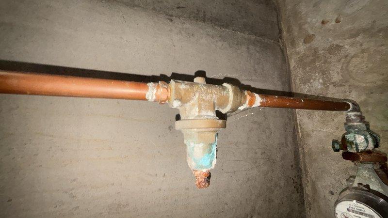 Responded to service call for faulty pressure regulator and shut-off valve on main water line. Successfully removed and replaced worn brass pressure reducing valve assembly with new unit, including compression fittings on copper supply piping. Additionally replaced deteriorated shut-off valve showing signs of oxidation and compromised operation. Both valves were installed along the main water supply line in the basement utility area, restoring proper water pressure regulation and shut-off capability to the system.