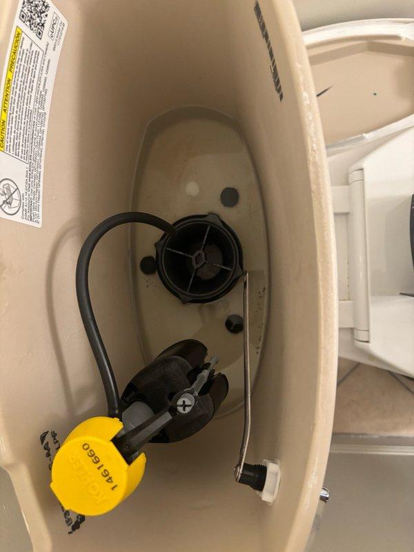 Responded to service call for non-functioning toilet in powder room. Upon inspection, identified faulty flapper valve assembly causing inadequate seal and preventing proper flush cycle. Removed tank lid and diagnosed worn TAG 660 flapper component that had deteriorated prematurely despite toilet being only one year old. Replaced defective flapper valve with new assembly, adjusted chain length for proper operation, and tested flush mechanism multiple times to ensure complete tank drainage and refill. Verified fill valve operation and water level settings were within manufacturer specifications. Toilet restored to full working order with proper flushing performance.
