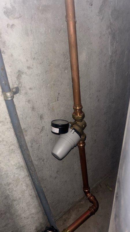 Conducted on-site evaluation for tankless water heater and water softener installation in basement location. Assessed existing gas water heater system, which is currently operational but over 10 years old, and documented existing copper piping configuration with brass valve assembly and monitoring equipment. Provided estimate for replacing conventional 50-gallon gas unit with tankless system and installing water softener to meet customer's requested upgrades.