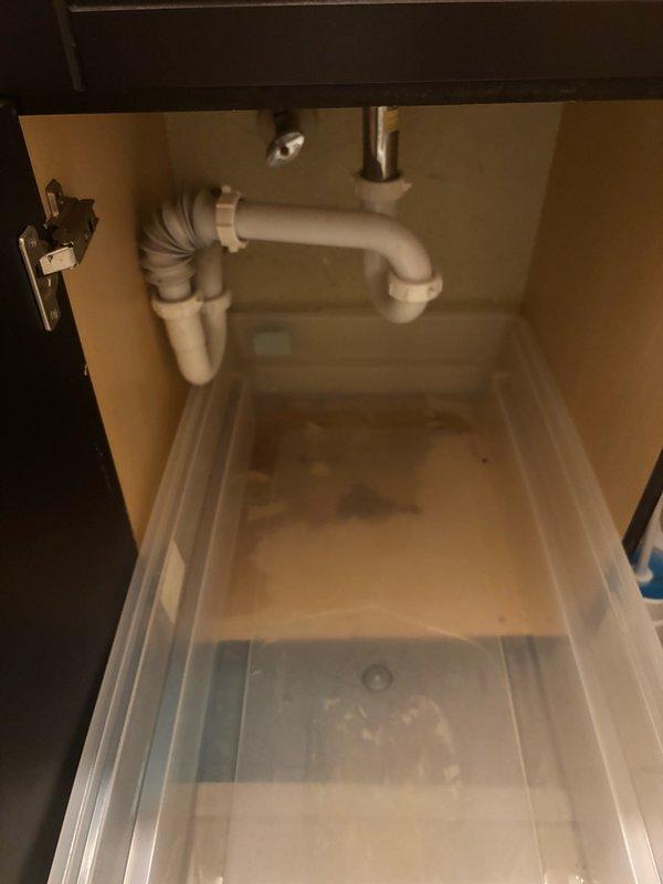 Responded to a clogged bathroom sink complaint and successfully cleared the drainage obstruction. Inspected the P-trap assembly and drain line beneath the vanity, verified proper water flow restoration, and confirmed the plumbing system was functioning correctly with no leaks present.