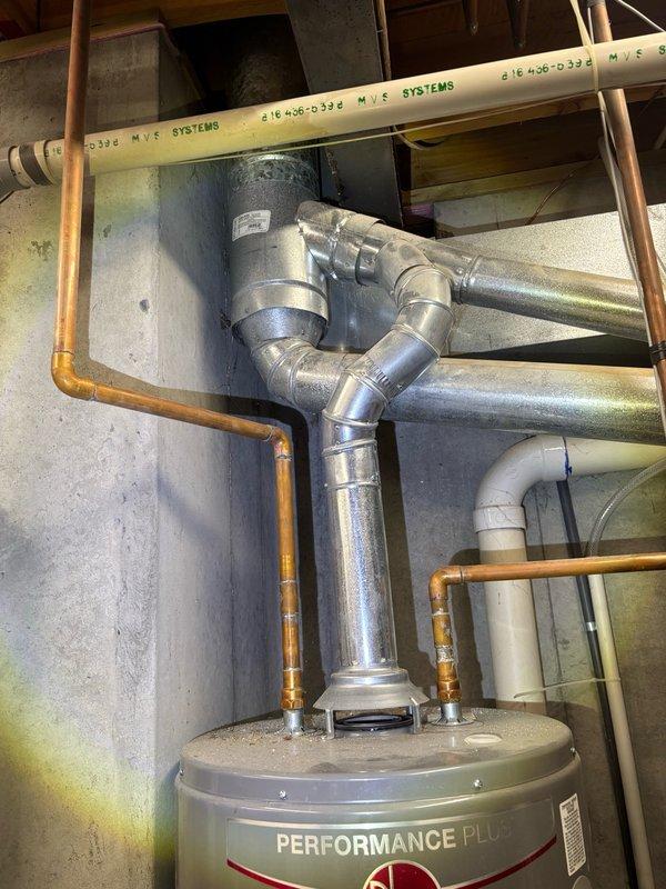 Completed comprehensive plumbing inspection of residential property, examining water heater installation, HVAC connections, copper supply lines, and under-sink plumbing fixtures. All systems found to be functioning properly with no immediate repairs required; customer provided estimate for sump pump battery backup system installation.