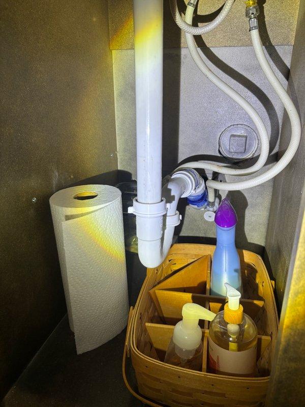 Completed comprehensive plumbing inspection of residential property, examining water heater installation, HVAC connections, copper supply lines, and under-sink plumbing fixtures. All systems found to be functioning properly with no immediate repairs required; customer provided estimate for sump pump battery backup system installation.