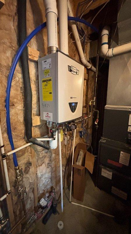Responded to service call for low water pressure affecting bathroom sink, shower, and toilet. Diagnosed air in water lines indicated by gurgling sounds reported during toilet flushing. Inspected tankless water heater installation, plumbing connections, and supply lines in utility area. Verified proper operation of shut-off valves, checked copper and PEX pipe connections for restrictions or blockages, and assessed system for potential air infiltration points that could cause intermittent pressure loss throughout bathroom fixtures.