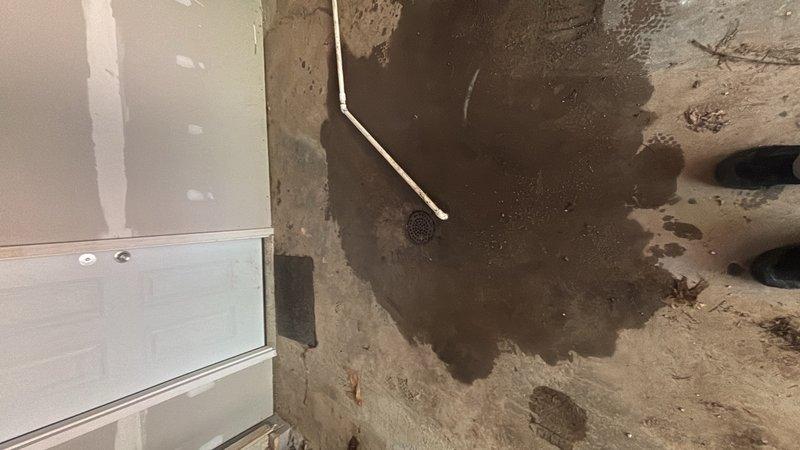 Responded to a clogged floor drain in the garage. Upon arrival, found standing water on the concrete floor surrounding the drain area, indicating a complete blockage in the drainage system. Successfully cleared the obstruction from the floor drain, restoring proper water flow and drainage function.