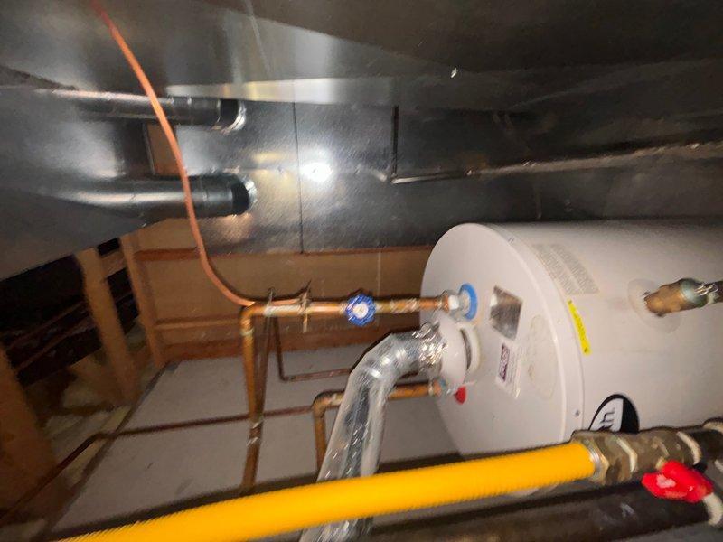 Responded to reported clogged drain in basement utility area. Upon arrival, accessed mechanical room housing water heater, HVAC ductwork, and associated plumbing systems. Inspected drainage system in confined utility space, identified blockage, and cleared obstruction to restore proper flow. Verified all drains functioning correctly upon completion.