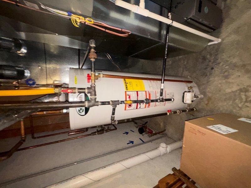 Responded to reported clogged drain in basement utility area. Upon arrival, accessed mechanical room housing water heater, HVAC ductwork, and associated plumbing systems. Inspected drainage system in confined utility space, identified blockage, and cleared obstruction to restore proper flow. Verified all drains functioning correctly upon completion.