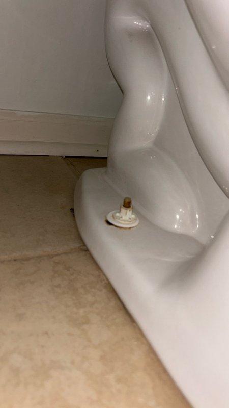 Responded to reported clogged toilet in downstairs bathroom. Upon arrival, accessed property via rear entrance as instructed. Inspected toilet and removed tank lid to assess internal flush mechanism and fill valve operation. Determined blockage was localized to toilet fixture rather than main drain line. Successfully cleared obstruction and restored proper flushing function. Verified water flow, fill valve operation, and proper tank refill cycle. Tested flush multiple times to confirm complete resolution. Replaced tank lid and left fixture in full working order.