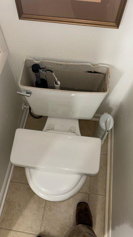 Responded to reported clogged toilet in downstairs bathroom. Upon arrival, accessed property via rear entrance as instructed. Inspected toilet and removed tank lid to assess internal flush mechanism and fill valve operation. Determined blockage was localized to toilet fixture rather than main drain line. Successfully cleared obstruction and restored proper flushing function. Verified water flow, fill valve operation, and proper tank refill cycle. Tested flush multiple times to confirm complete resolution. Replaced tank lid and left fixture in full working order.