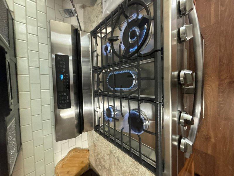 Successfully installed a second coupling on the residential gas line to support the five-burner gas cooktop. The gas piping installation was completed in accordance with code requirements, with all connections tested and verified for proper operation. All burners were confirmed igniting with proper blue flame combustion upon completion.