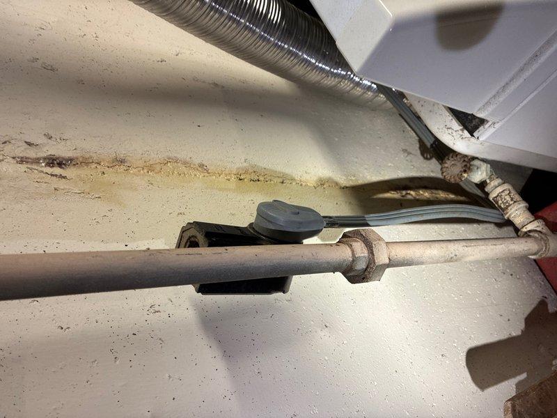 Responded to follow-up service call to locate and repair LP gas leak affecting house gas supply. Upon inspection of mechanical space, identified leak at copper gas line union fitting serving appliance connections. Tested system pressure and confirmed loss at compromised joint connection. Disassembled union fitting, inspected mating surfaces for damage and debris, cleaned threads, and applied appropriate pipe thread sealant. Reassembled connection with proper torque specifications. Performed pressure test on repaired section and complete gas distribution system to verify integrity of repair. Tested all downstream connections including shutoff valves and flexible connectors for additional leaks using approved detection methods. Confirmed no leaks present at repair site or associated piping. Restored gas service to house and verified proper operation of connected appliances. System returned to full operational status with all safety checks completed satisfactorily.