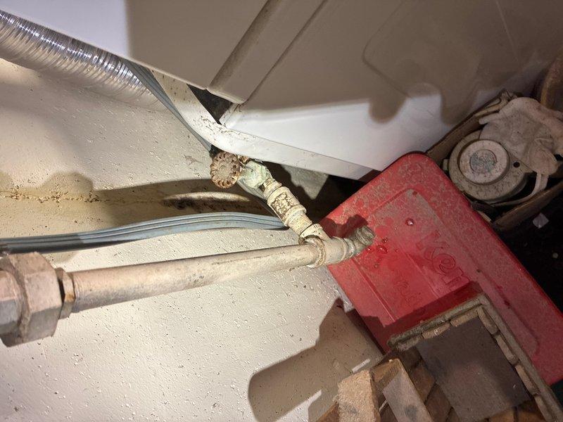 Responded to follow-up service call to locate and repair LP gas leak affecting house gas supply. Upon inspection of mechanical space, identified leak at copper gas line union fitting serving appliance connections. Tested system pressure and confirmed loss at compromised joint connection. Disassembled union fitting, inspected mating surfaces for damage and debris, cleaned threads, and applied appropriate pipe thread sealant. Reassembled connection with proper torque specifications. Performed pressure test on repaired section and complete gas distribution system to verify integrity of repair. Tested all downstream connections including shutoff valves and flexible connectors for additional leaks using approved detection methods. Confirmed no leaks present at repair site or associated piping. Restored gas service to house and verified proper operation of connected appliances. System returned to full operational status with all safety checks completed satisfactorily.