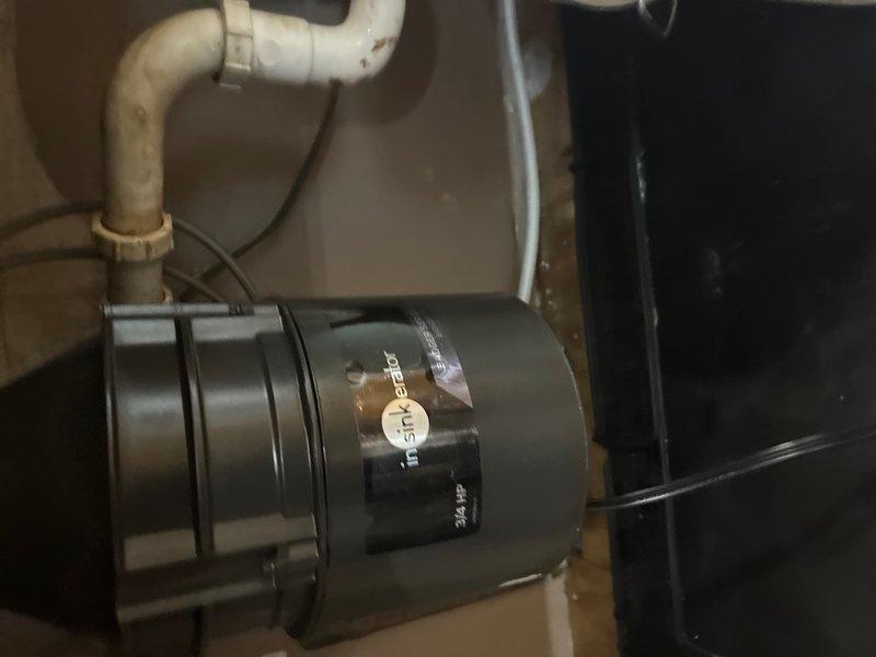 Installed customer-supplied garbage disposal unit under kitchen sink, connecting to existing drain plumbing and electrical supply. Verified proper operation of disposal and confirmed drain assembly is secure with no leaks detected during testing.