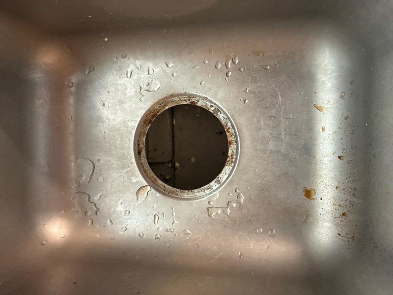 Installed customer-supplied garbage disposal unit under kitchen sink, connecting to existing drain plumbing and electrical supply. Verified proper operation of disposal and confirmed drain assembly is secure with no leaks detected during testing.