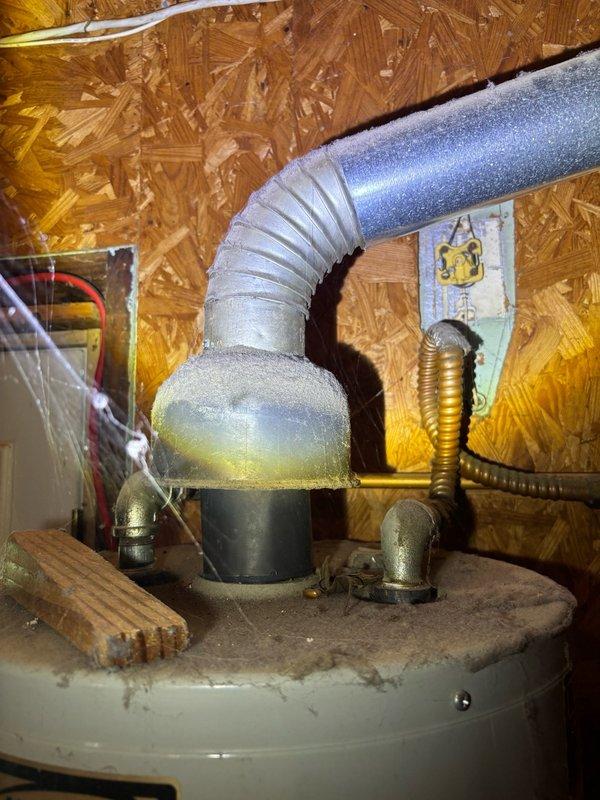 Completed comprehensive whole home plumbing inspection of residential property. Inspected water heater installation in attic space, verifying proper venting configuration, pressure relief valve operation, and supply line connections. Examined toilet tank components in bathroom, noting Korky fill valve assembly and flush mechanism in functional condition with minor sediment accumulation observed in tank bottom. All accessible plumbing fixtures, supply lines, and mechanical systems documented photographically for homeowner records.