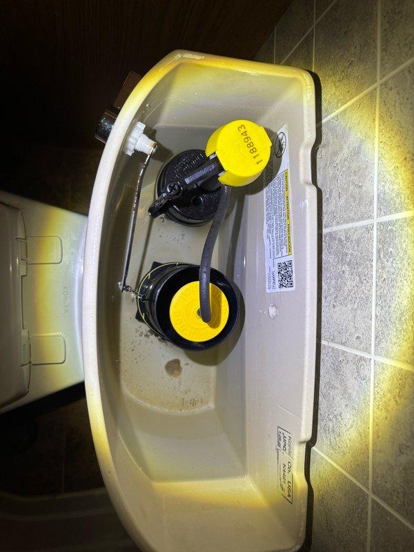 Completed comprehensive whole home plumbing inspection of residential property. Inspected water heater installation in attic space, verifying proper venting configuration, pressure relief valve operation, and supply line connections. Examined toilet tank components in bathroom, noting Korky fill valve assembly and flush mechanism in functional condition with minor sediment accumulation observed in tank bottom. All accessible plumbing fixtures, supply lines, and mechanical systems documented photographically for homeowner records.