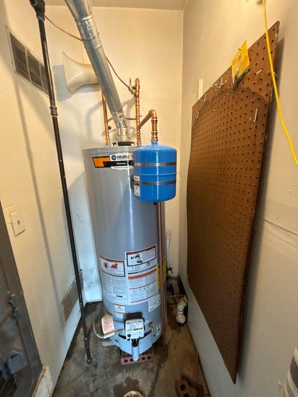 Successfully installed a 50-gallon gas water heater in the utility closet, including all necessary plumbing connections with copper piping, brass fittings, and shut-off valves. Mounted and connected a blue expansion tank to the system and installed proper ventilation ductwork to ensure safe exhaust of combustion gases. All components were installed to code with appropriate safety labels visible, system tested for proper operation, and workspace left clean upon completion.