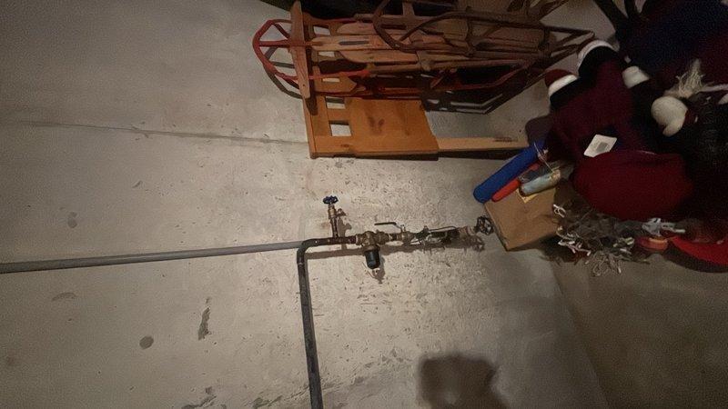Performed routine plumbing system inspection and pressure testing on residential water supply lines. Inspected basement plumbing configuration including brass valve assembly and pressure gauge connections, verified proper pressure readings and system operation, and documented equipment condition with photographs for maintenance records.
