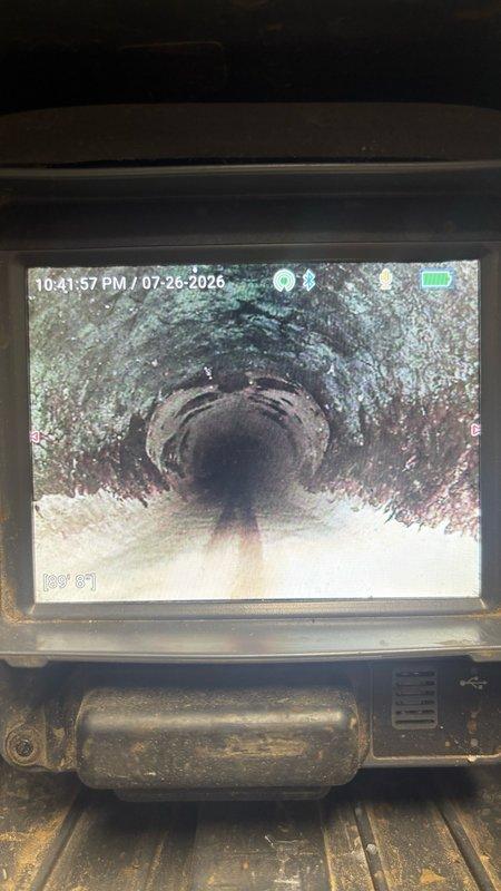 Responded to backup issue in residential plumbing system. Performed video camera inspection of sewer line to identify source of drainage problem, revealing significant buildup and debris accumulation within the pipe interior. Documentation captured showing compromised pipe condition with visible contamination affecting flow capacity.