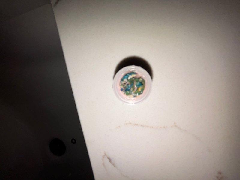 Responded to whole-house low water pressure complaint at a three-year-old residential property. Upon arrival, confirmed best contact number and located main water shutoff valve in basement. Conducted systematic pressure testing and inspection throughout the home to identify the source of reduced water flow. Examined plumbing fixtures in multiple rooms, including bathroom facilities. Inspected aerators and fixture components for debris or mineral buildup that could restrict flow. Documented conditions with photographs showing bathroom fixtures and sink drain areas. Verified proper operation of main shutoff valve and checked for any partial closure or valve malfunction that could cause pressure reduction throughout the dwelling. Completed diagnostic assessment during scheduled four-hour service window.