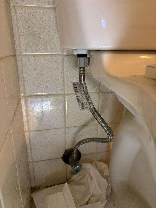 Replaced defective flush valve assembly in hall bathroom toilet. Shut off water supply at wall-mounted valve, disconnected braided stainless steel supply line from tank, and removed old flush valve mechanism. Installed new flush valve, reconnected water supply line, restored water flow, and tested toilet for proper flushing operation and leak-free connections. Verified system functionality and left work area clean.