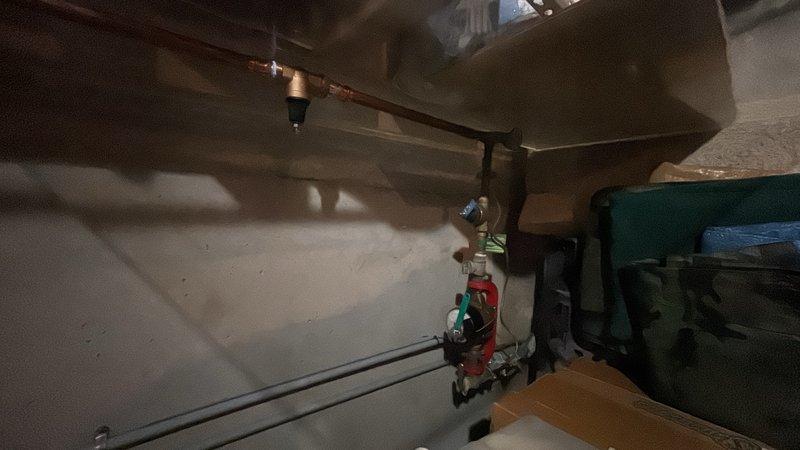Performed comprehensive plumbing maintenance inspection of water heater system and associated components. Verified proper operation of pressure relief valve, checked pressure gauge readings to ensure system was operating within safe parameters, and inspected all visible piping connections including copper supply lines and brass fittings for leaks or corrosion. Examined condition of water heater tank, mounting hardware, and surrounding plumbing infrastructure in utility area to ensure thorough assessment per customer request.