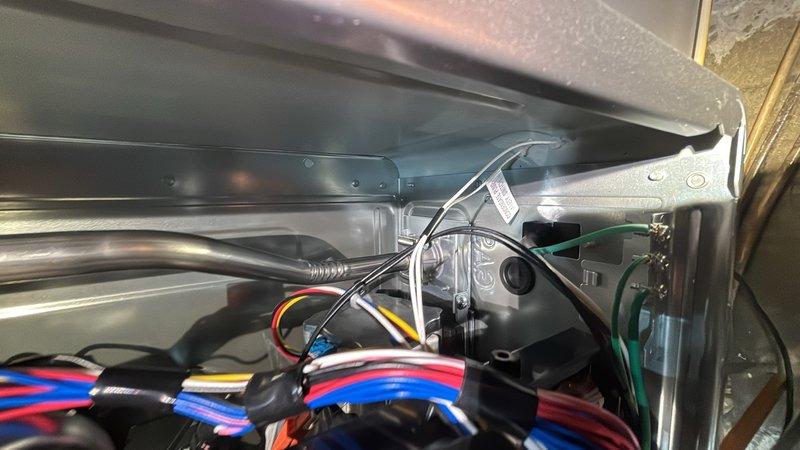 Responded to service call for tankless water heater displaying error codes 55 and 49. Performed diagnostic inspection of unit's internal components, control board, and wiring connections. Inspected condensate drain pan, verified proper drainage function, and examined refrigerant lines and mechanical connections for proper operation. Checked electrical wiring compartment, control module, and all wire terminations to ensure system integrity and resolve error condition.