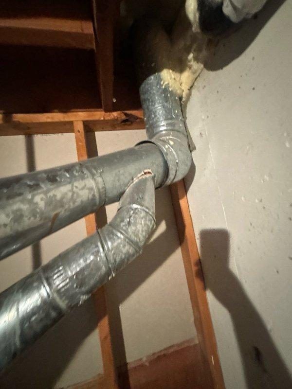 Performed assessment of non-functional 50-gallon gas water heater located in basement. Unit was over 20 years old and required complete replacement. Inspection revealed significant corrosion on top-mounted pipe connections with heavy rust staining across the appliance surface. Deteriorated elbow fittings and corroded piping connections indicated extensive wear from age and moisture exposure. Documented existing copper supply lines, gas connections, and venting system configuration. Provided estimate for replacement of tanked gas water heater with comparable 50-gallon capacity unit, including removal of existing appliance and installation of new equipment with proper venting and code-compliant connections.