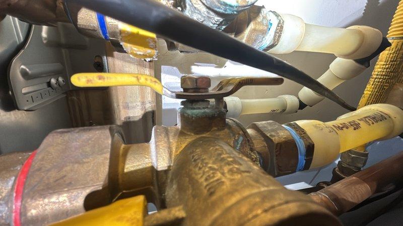 Responded to follow-up service call for tankless water heater in garage with reported loud noise from fan assembly. Inspected unit and confirmed fan motor failure requiring replacement. Documented existing plumbing connections, gas valves, and internal blower assembly components for parts ordering and future repair completion.