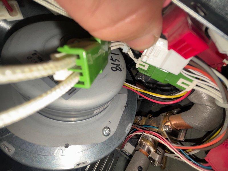 Responded to follow-up service call for tankless water heater in garage with reported loud noise from fan assembly. Inspected unit and confirmed fan motor failure requiring replacement. Documented existing plumbing connections, gas valves, and internal blower assembly components for parts ordering and future repair completion.