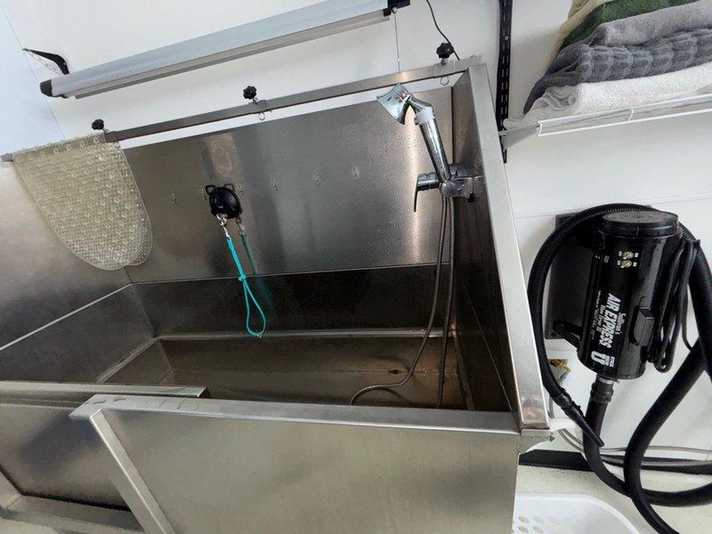 Responded to service call for non-operational one-year-old tankless water heater installed in vaulted ceiling at 12-foot height. Used ladder to access unit for diagnostic evaluation. Upon inspection, identified issue preventing proper unit operation. Performed necessary troubleshooting procedures and completed repairs to restore hot water functionality. Unit tested and confirmed operational at conclusion of service visit.