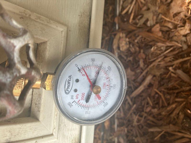 Responded to reported leak on 50-gallon gas water heater with power vent located in basement. Upon inspection, confirmed active water seepage from underneath tank assembly, indicating internal tank failure. Evaluated pressure relief valve, supply connections, and drain valve for potential leak sources; determined leak originated from compromised tank bottom rather than serviceable components. Documented condition of existing copper supply piping, mounting hardware, and venting system. Advised customer that tank replacement is necessary as internal tank corrosion and failure cannot be repaired.