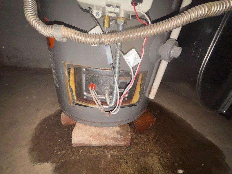 Replaced defective water heater burner assembly under warranty coverage. Disconnected electrical connections and gas supply line, removed failed burner component, and installed new OEM replacement burner. Reconnected all wiring harnesses, verified proper electrical continuity, and restored gas supply. Tested ignition sequence and confirmed proper flame operation and temperature control functionality. Unit restored to full operational status with all safety systems functioning as designed.