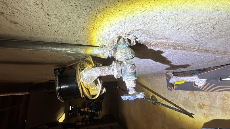Responded to service call for malfunctioning shut-off valves in laundry area that would not close properly. Upon inspection, found worn washer supply valves with compromised sealing mechanisms preventing complete water shut-off. Replaced faulty quarter-turn ball valves with new brass ball valve assemblies featuring durable compression fittings and lever handles for reliable operation. Installed valves on both hot and cold water supply lines using flexible connector hoses to ensure proper water control to washing machine. Additionally assessed main water shut-off valve condition as requested and determined replacement necessary due to age and corrosion visible on existing gate valve assembly. All new valves tested for proper operation and confirmed complete water shut-off capability with no leaks detected at connection points.