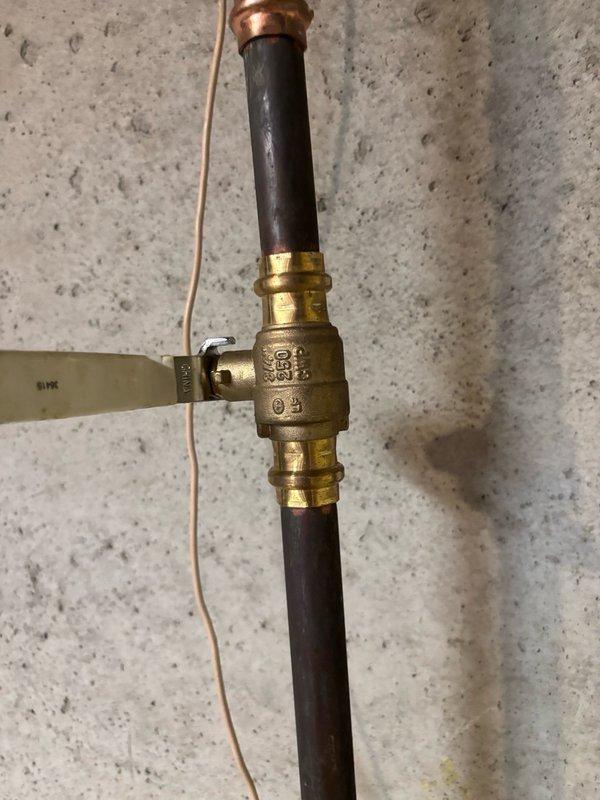 Responded to service call for malfunctioning shut-off valves in laundry area that would not close properly. Upon inspection, found worn washer supply valves with compromised sealing mechanisms preventing complete water shut-off. Replaced faulty quarter-turn ball valves with new brass ball valve assemblies featuring durable compression fittings and lever handles for reliable operation. Installed valves on both hot and cold water supply lines using flexible connector hoses to ensure proper water control to washing machine. Additionally assessed main water shut-off valve condition as requested and determined replacement necessary due to age and corrosion visible on existing gate valve assembly. All new valves tested for proper operation and confirmed complete water shut-off capability with no leaks detected at connection points.