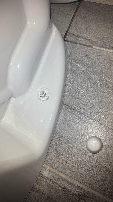 Responded to emergency service call for water leak at toilet fixture on first floor. Upon arrival, found water supply turned off by customer due to active leak. Inspected toilet base and identified source of leak at water supply connection point. Examined toilet mounting and floor seal integrity. Tightened supply line connection and verified proper seating of toilet base to floor flange. Checked for secondary moisture damage and identified water staining on ceiling below, indicating previous leak migration. Restored water supply and pressure-tested all connections to confirm leak resolution. Verified proper toilet operation and no active water discharge. Documented conditions with photographic evidence showing toilet installation and ceiling water damage patterns for maintenance records.